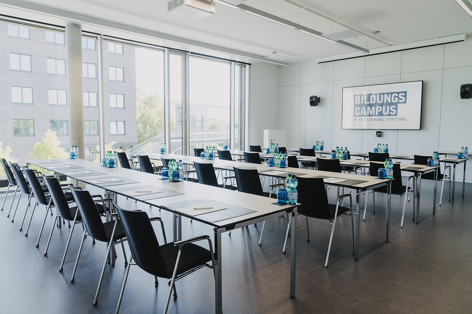 Photo of a parliamentary seating arrangement in the conference room.